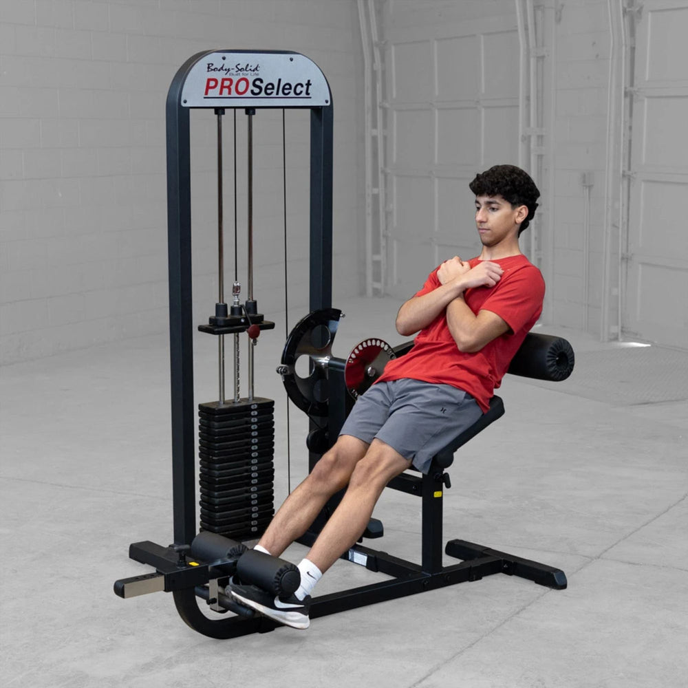 Person using a cable ab machine in a gym setting with 'Body-Solid ProSelect' branding.