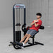 Person using a cable ab machine in a gym setting with 'Body-Solid ProSelect' branding.