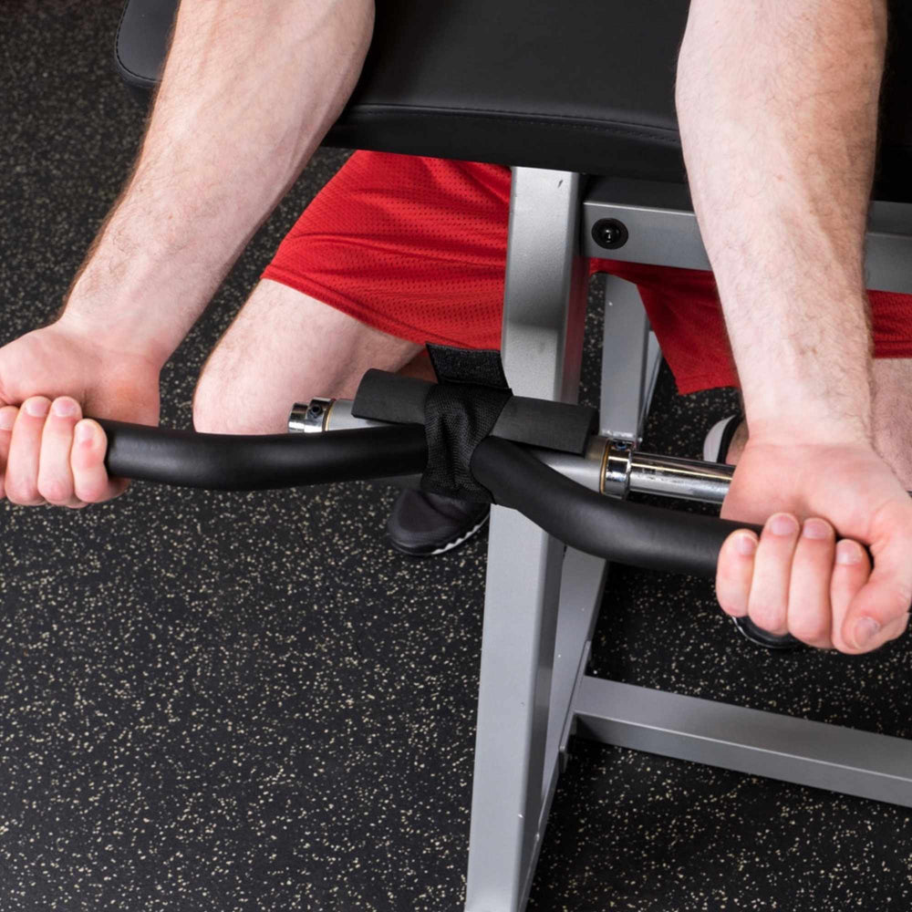 Body-Solid Pro Select CAM Biceps Triceps Machine GCBT-STK Man Exercising With Handles