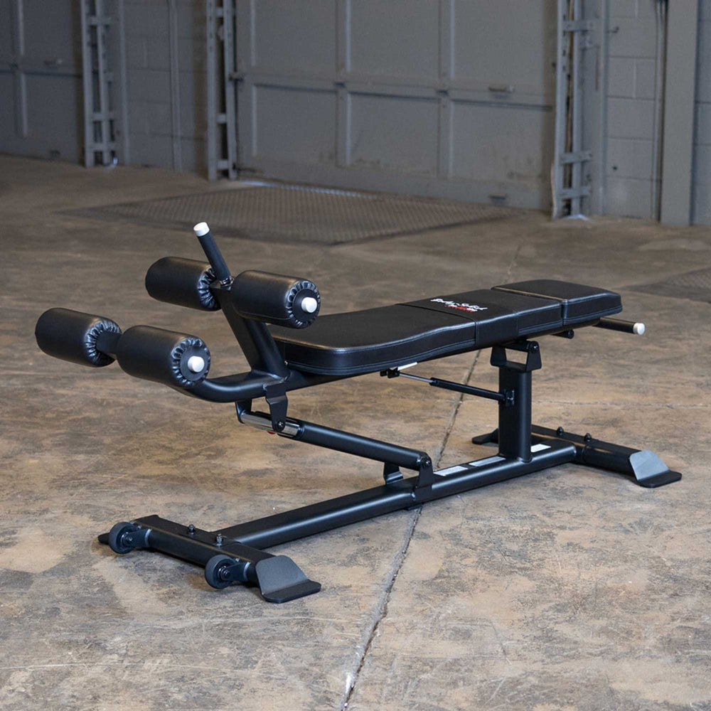 Body-Solid Proclub Commercial Ab Bench SAB500B Exercise bench with close-up view of leg support rollers