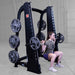 Body-Solid Proclub Counter Balanced Smith Machine SCB1000B A woman doing a Smith machine back squat with the bar positioned on her shoulders, squatting low in a gym.
