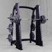 Body-Solid Proclub Counter Balanced Smith Machine SCB1000B Body-Solid Smith machine fully loaded with weight plates on both sides in a commercial gym
