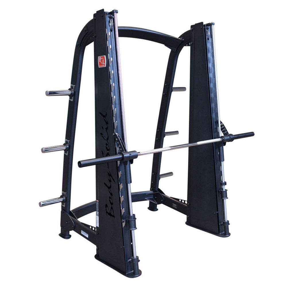 Body-Solid Proclub Counter Balanced Smith Machine SCB1000B Body-Solid Smith machine with plate storage posts and secured barbell, isolated on a white background.