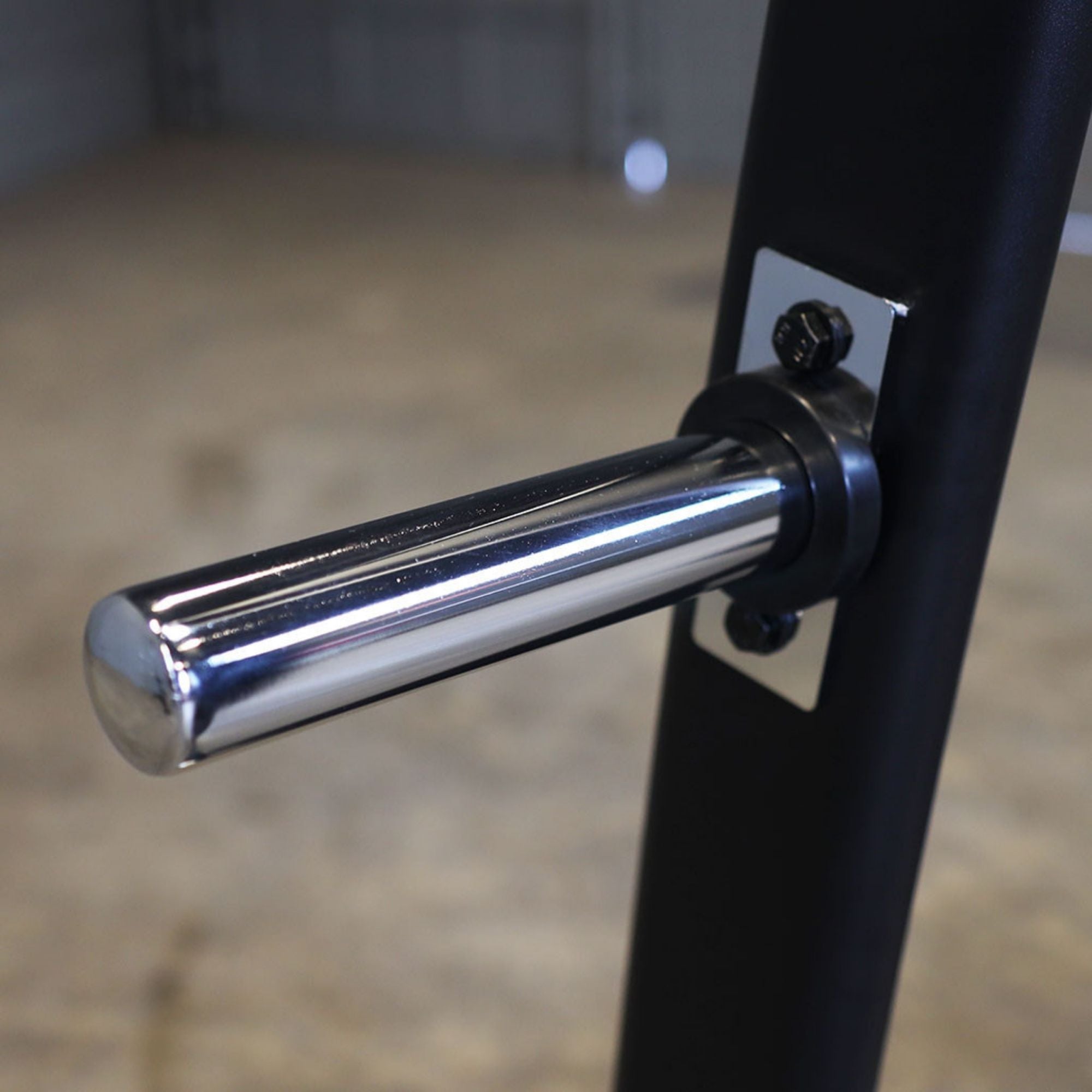 Body-Solid Proclub Counter Balanced Smith Machine SCB1000B Close-up of a chrome weight plate storage peg attached to a Smith machine frame.