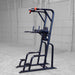 Body-Solid Proclub Vertical Knee Raise SVKR1000BX Full view of a tall black power tower exercise station in a large warehouse-style gym.