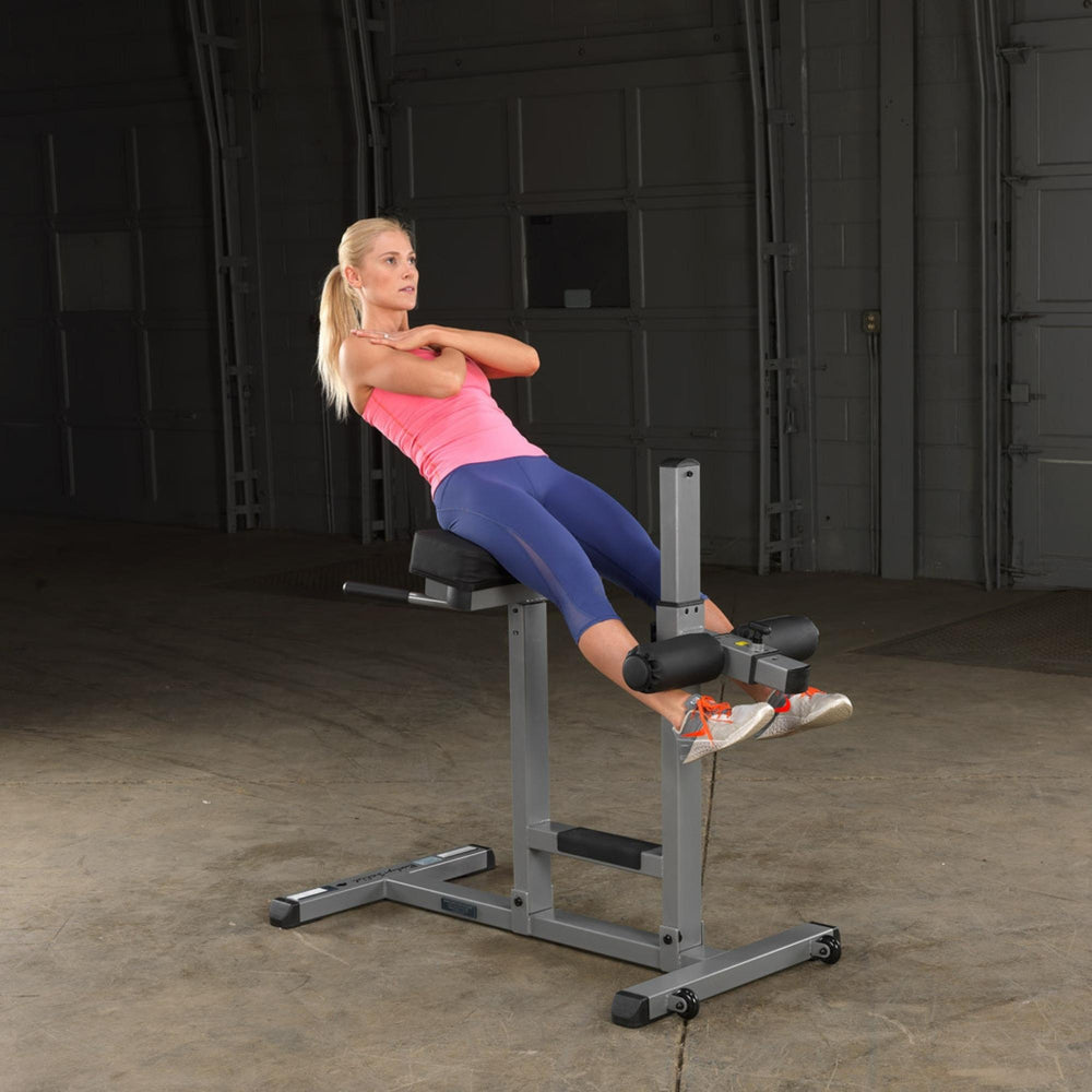 Body-Solid Roman Chair GRCH322B The user is at the top of the hyperextension movement