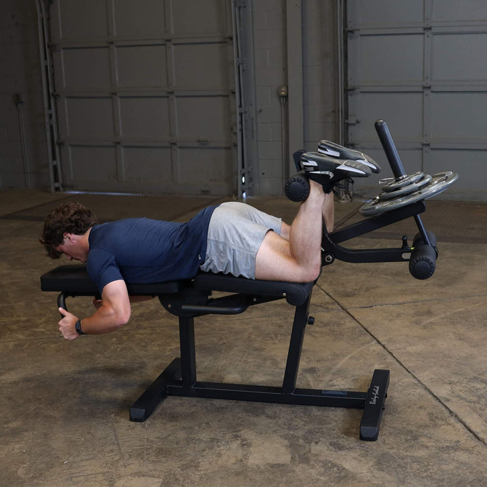 Body-Solid Seated Leg Extension & Supine Curl GLCE365B machine shown in four adjustable seat positions