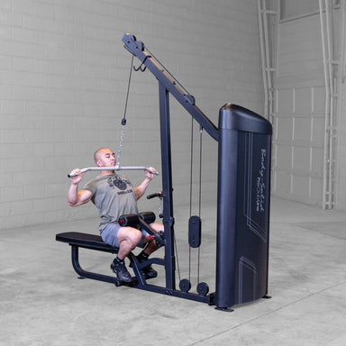 Body-Solid Series 2 Lat Mid Row S2LATX  Man using Body-Solid ProClub Line lat pulldown machine in a commercial gym setting, pulling bar down during exercise