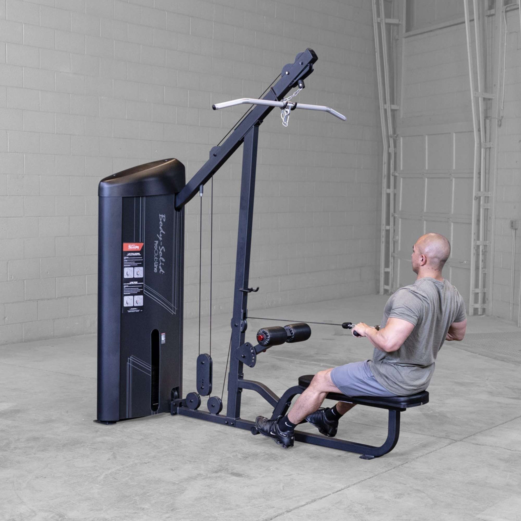 Body-Solid Series 2 Lat Mid Row S2LATX  Man using Body-Solid ProClub Line machine performing a seated row exercise with neutral grip handle