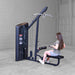 Body-Solid Series 2 Lat Mid Row S2LATX  Rear view of woman performing a seated low row exercise on the Body-Solid ProClub Line machine with cable attachment