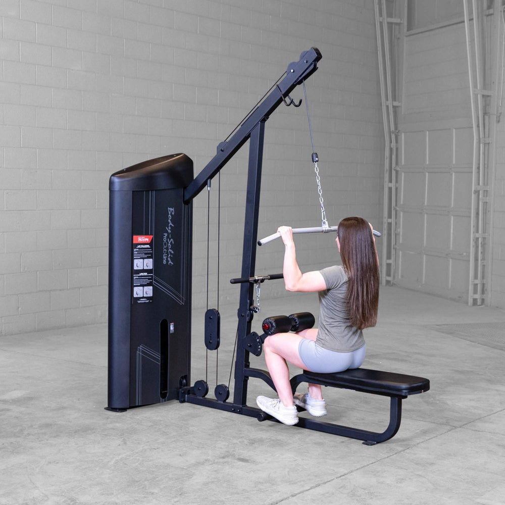 Body-Solid Series 2 Lat Mid Row S2LATX  Rear view of woman using Body-Solid ProClub Line lat pulldown machine pulling wide-grip bar toward her shoulders