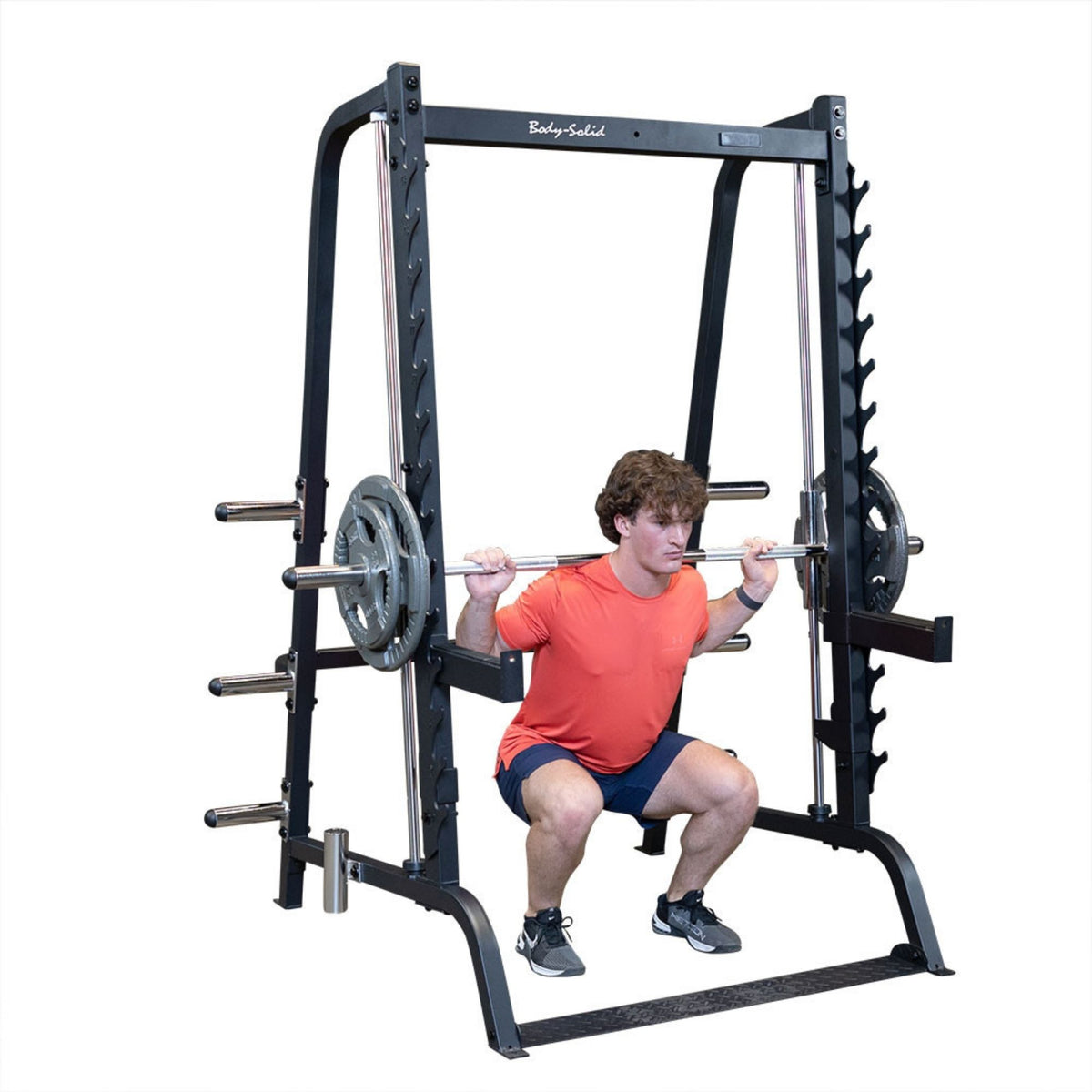 Body-Solid Series 7 Smith Machine GS348B Man performing barbell squats on Smith Machine