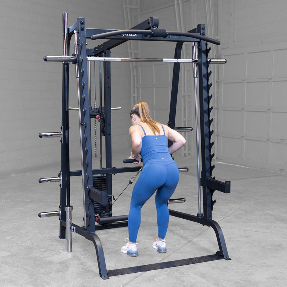Body-Solid Series 7 Smith Machine Gym Package GS348QB4 Woman doing cable tricep pushdowns using Body-Solid functional trainer
