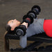 Body-Solid Tools Adjustable Dumbbell Set, 11 lb. to 66 lb. with Stand SDBX132ST Woman performing chest press on a bench using adjustable dumbbells