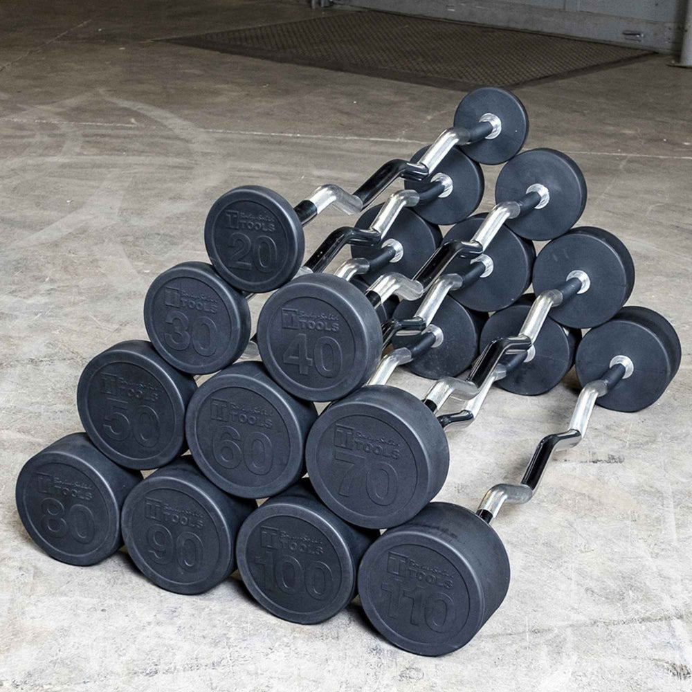 Body-Solid Tools Fixed Weight EZ Curl Barbells, from 20 to 110 lb. Rubber-coated EZ curl bar set in pyramid arrangement ranging from 20 to 110 lb