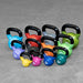 Body-Solid Tools KBV Vinyl Dipped Kettlebells KBVS275 A set of colorful kettlebells arranged on a gray surface, each kettlebell labeled with its weight in pounds.