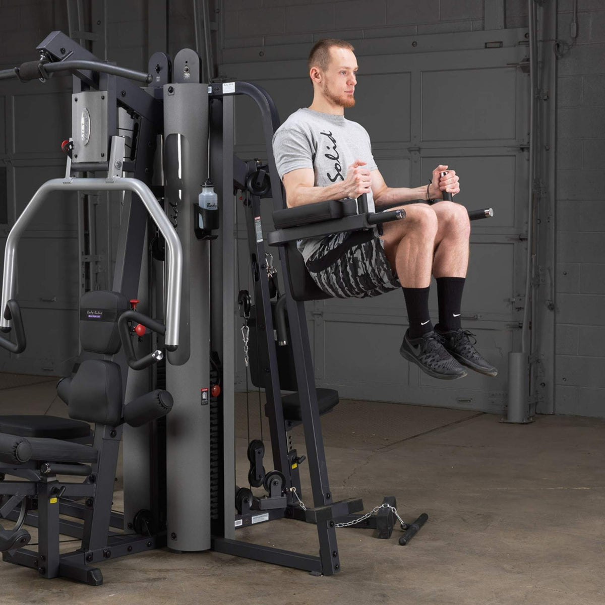 Body-Solid Vertical Knee Raise Attachment GKR9 user performing knee raise