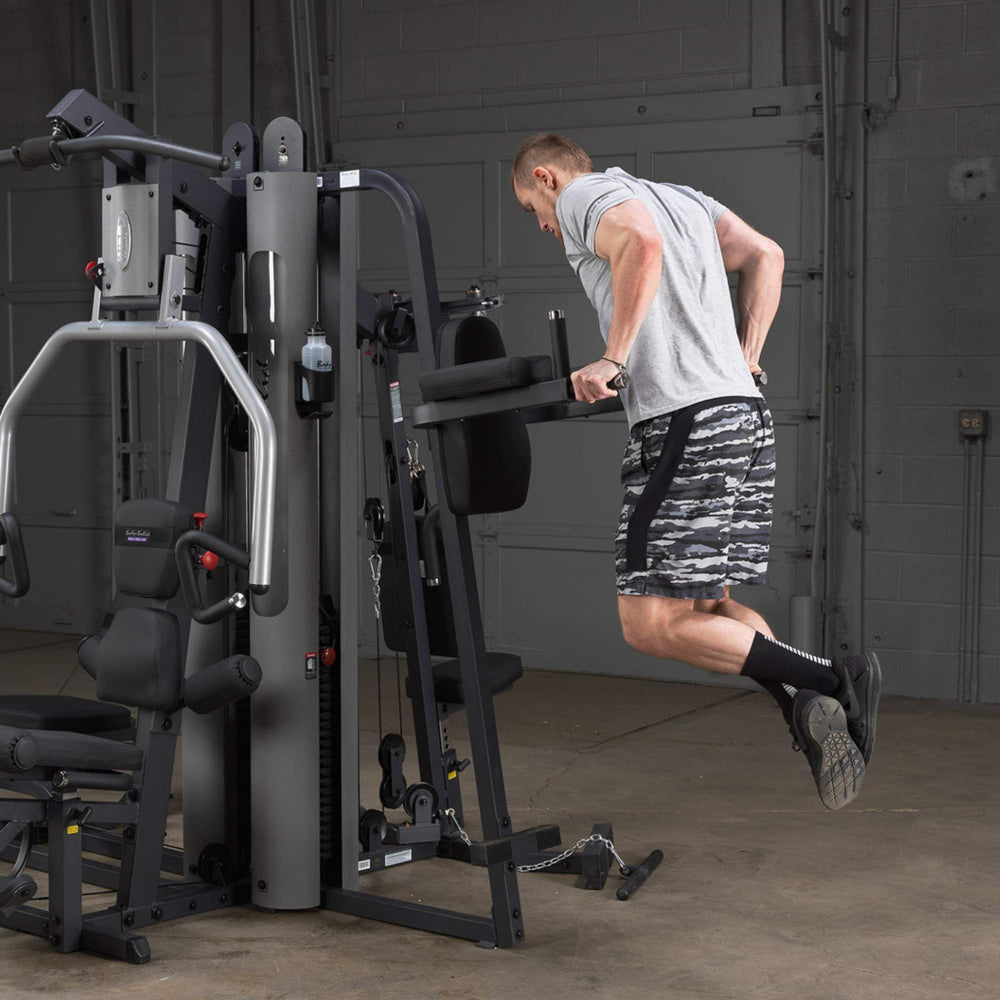 Body-Solid Vertical Knee Raise Attachment GKR9 user performing knee raise back view