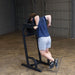 Body-Solid Vertical Knee Raise and Dip GVKR60B Man performing tricep dips on a Body-Solid vertical knee raise and dip station