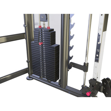 A Bodykore stack of black weight plates with red adjustment knobs and white printed weight markings, mounted on a dark metal cable machine frame against a white background.