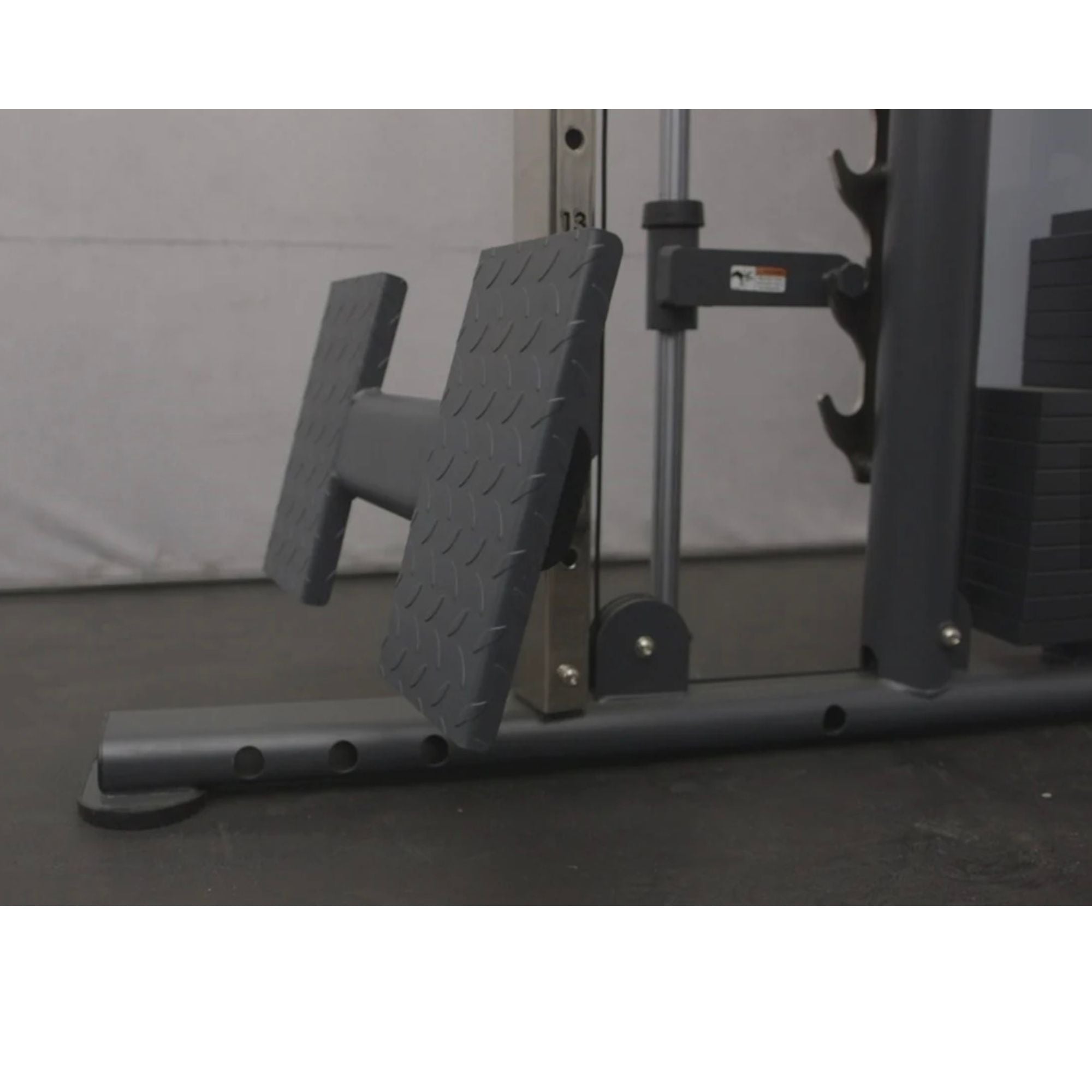 BodyKore-Universal-Trainer-Low-Row-Footplate-MX1192-in-a-gym-side-view