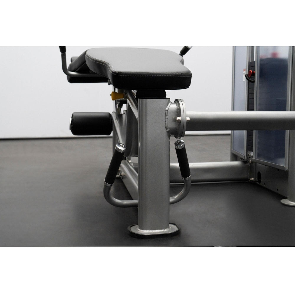 BodyKore Leg Extension/Leg Prone GR643 Close-up Side view of a BodyKore leg machine highlighting the seat padding