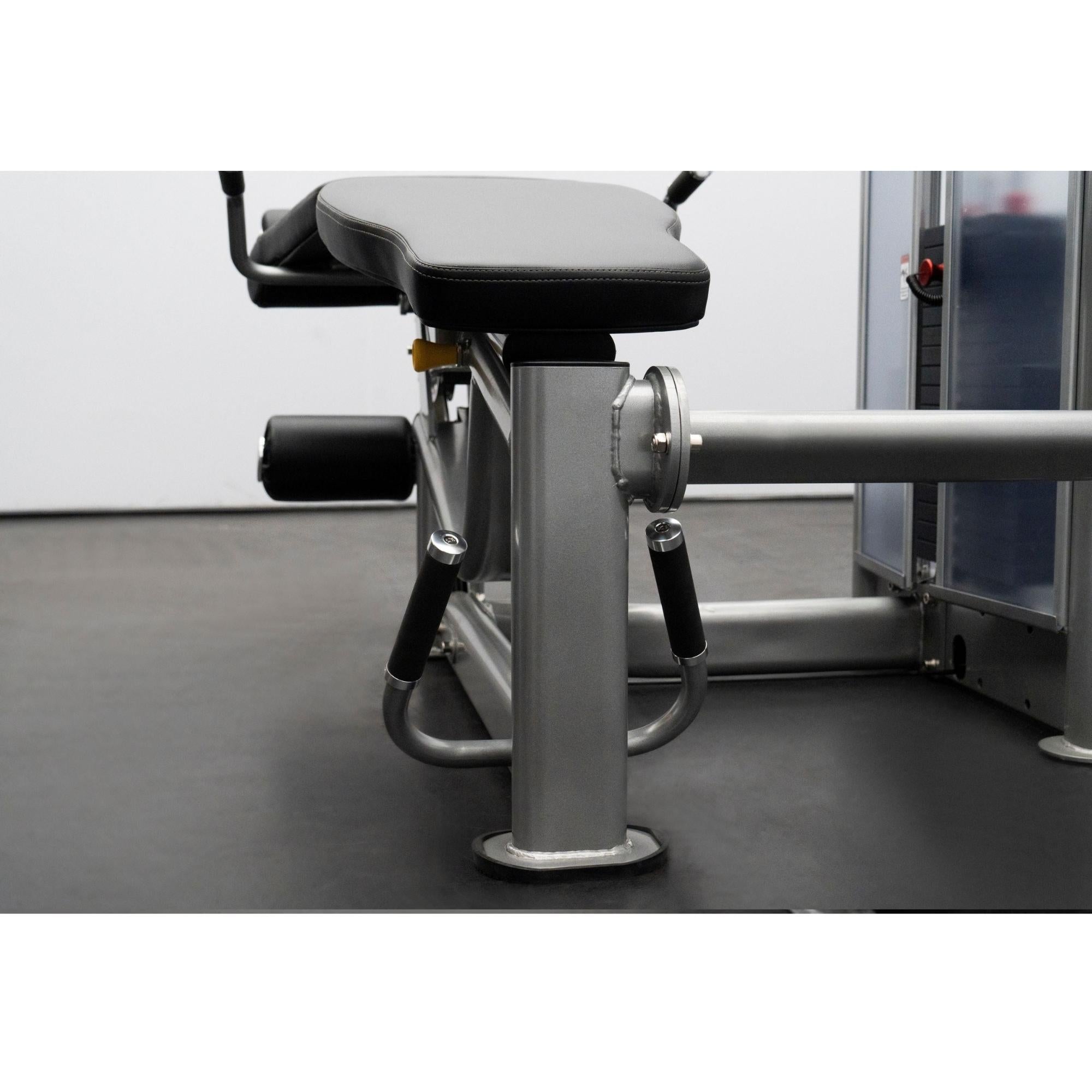 BodyKore Leg Extension/Leg Prone GR643 Close-up Side view of a BodyKore leg machine highlighting the seat padding