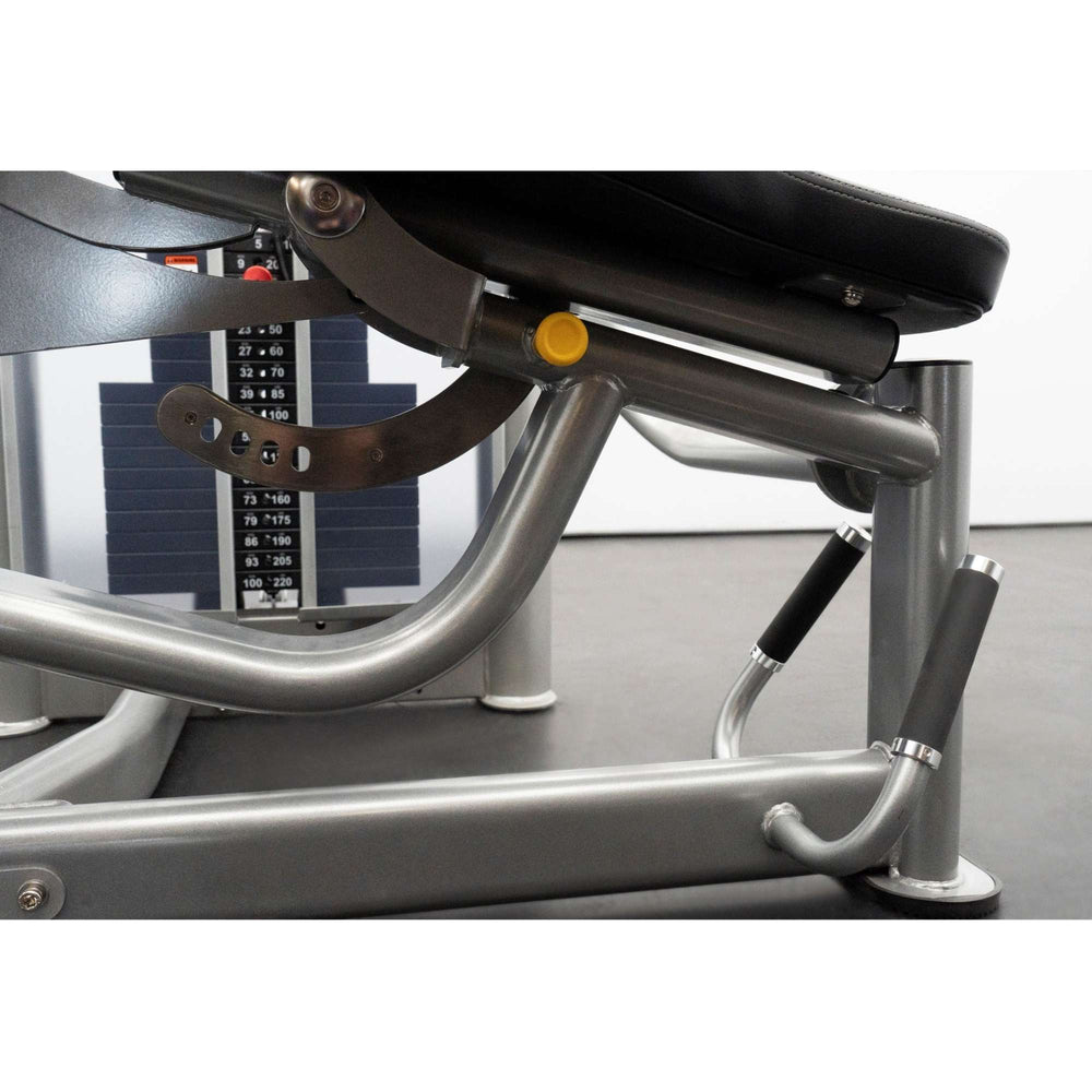 BodyKore Leg Extension/Leg Prone GR643 Close-up of a BodyKore leg machine's adjustment mechanism and weight stack
