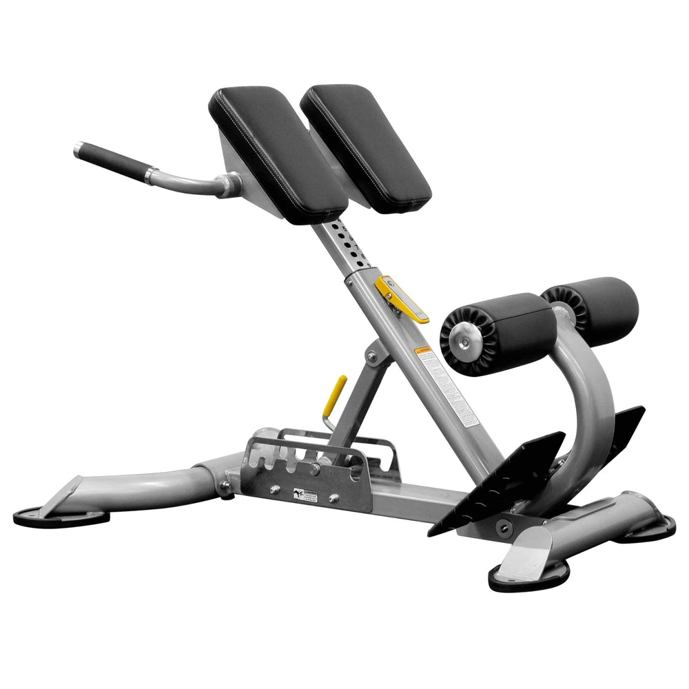 BodyKore Multi Hyper Extension CF2104 with padded support, foam leg rollers, and sturdy steel frame, designed for back and core strengthening exercises