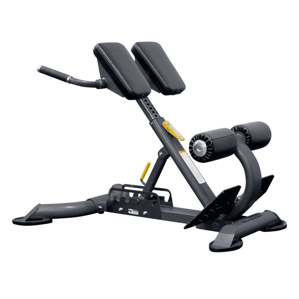 BodyKore Multi Hyper Extension CF2104 with padded support, foam leg rollers, and sturdy steel frame, designed for back and core strengthening exercises.