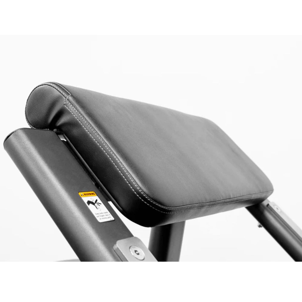 BodyKore Seated Preacher Curl G257 60° Pad Angle Increases Resistance While Decreasing Elbow Strain