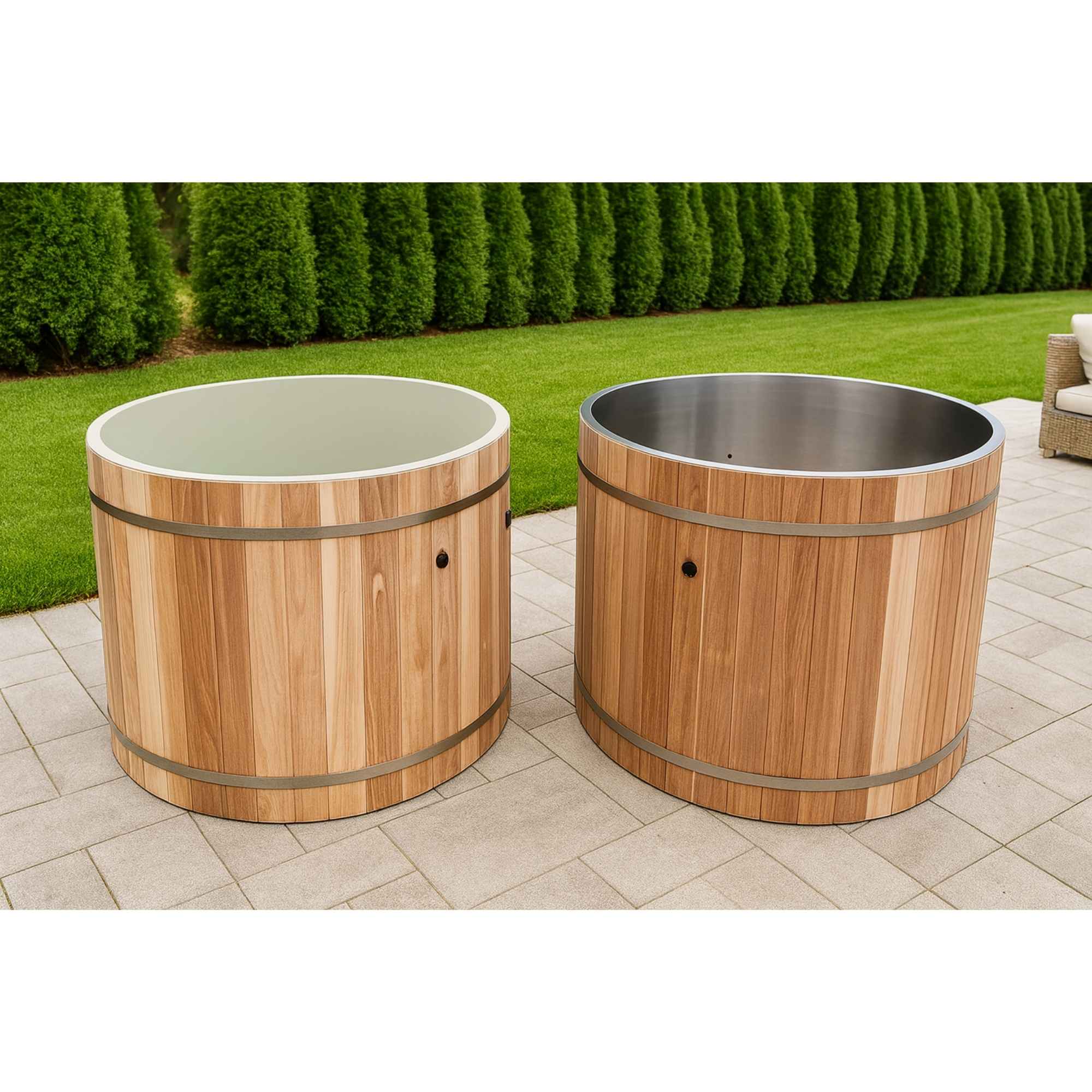 Two wooden barrel-style Dynamic cold plunges on a patio with grass and trees in the background.