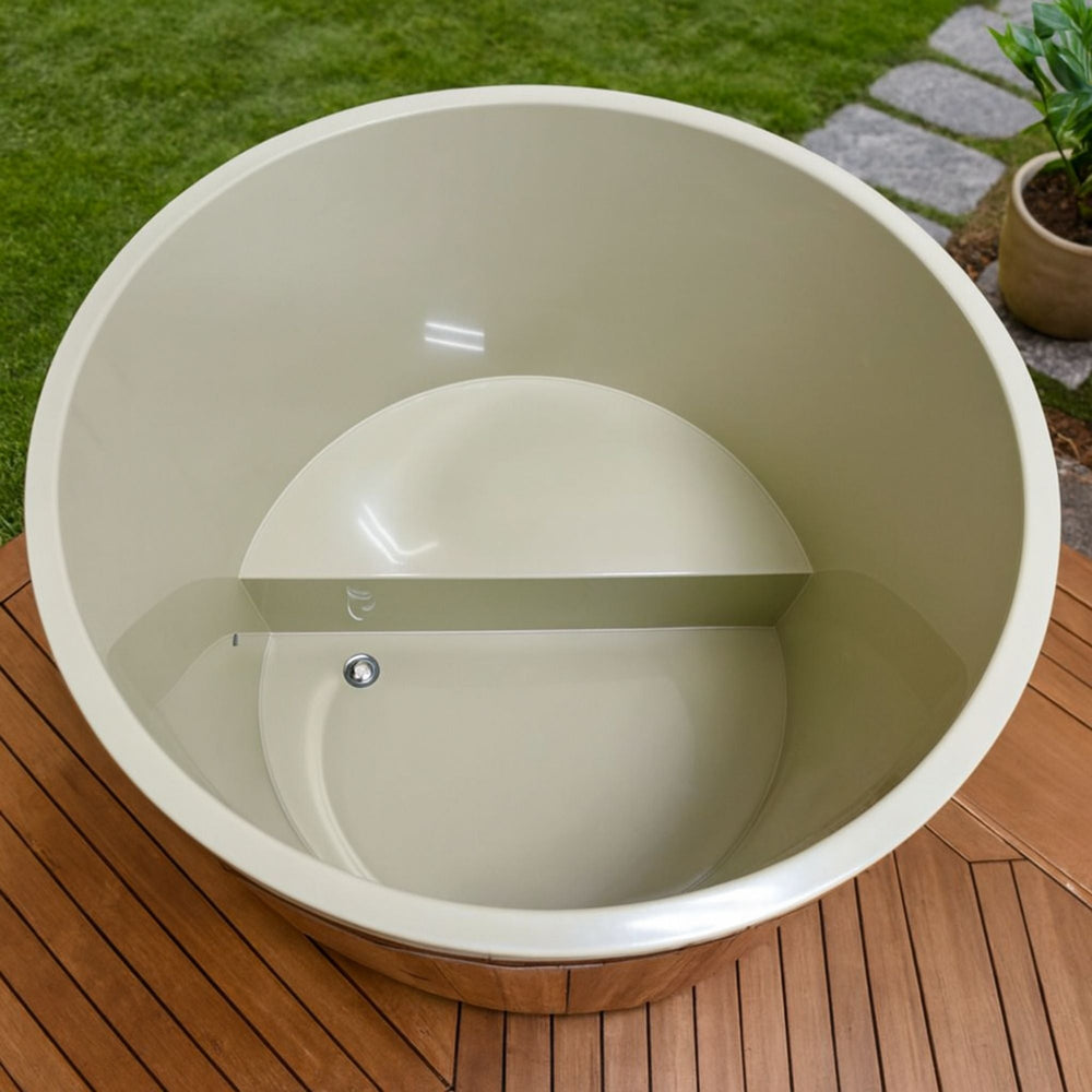 Beige outdoor Dynamic cold plunge on a wooden deck with grass in the background