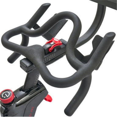 Echelon-EX-Pro-Bike-Close-up of a stationary bike handlebar with red buttons on a white background