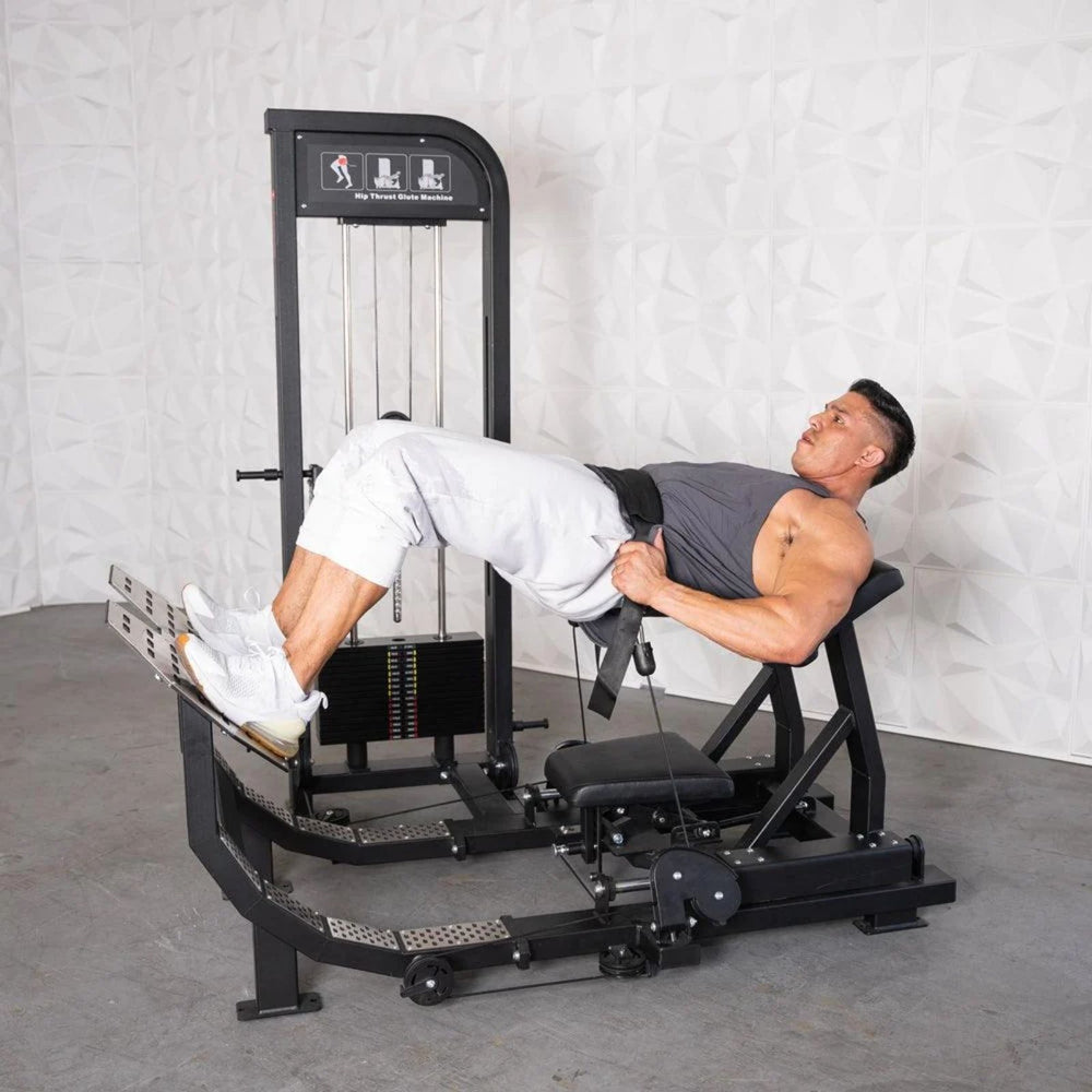 Man doing a glute bridge on a Excel Selectorized Hip Thrust Glute in a gym setting