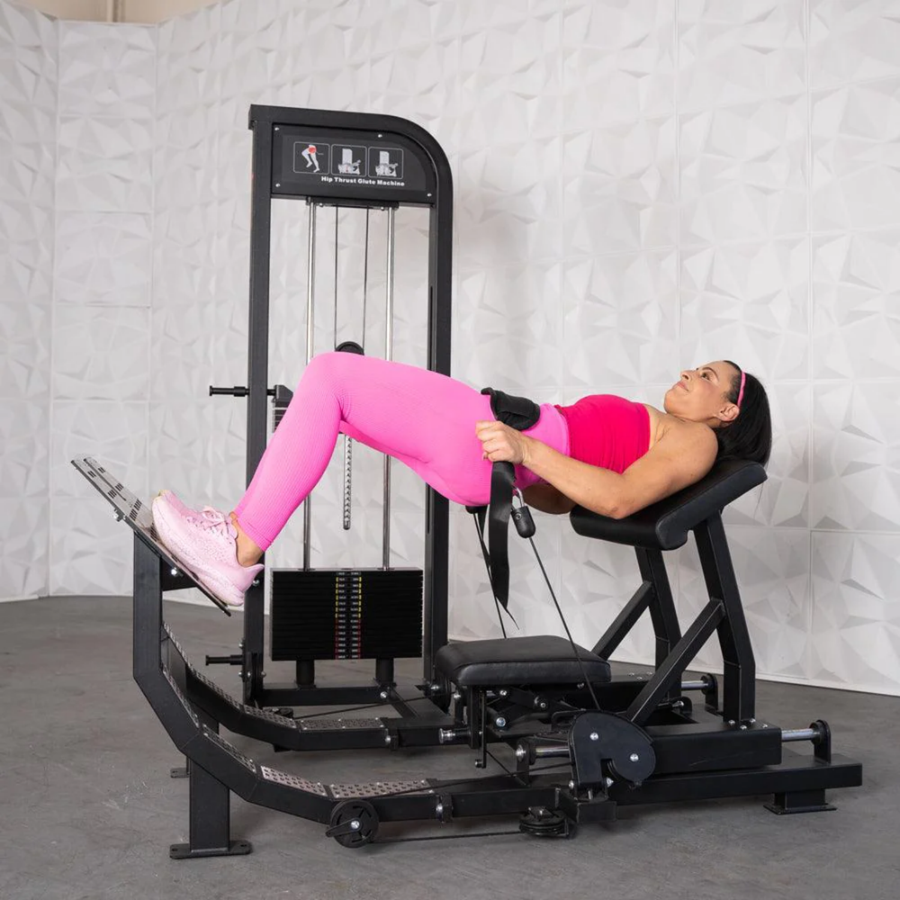 woman doing a glute bridge on an Muscle D Excel Selectorized Hip Thrust Glute S-G-HTG