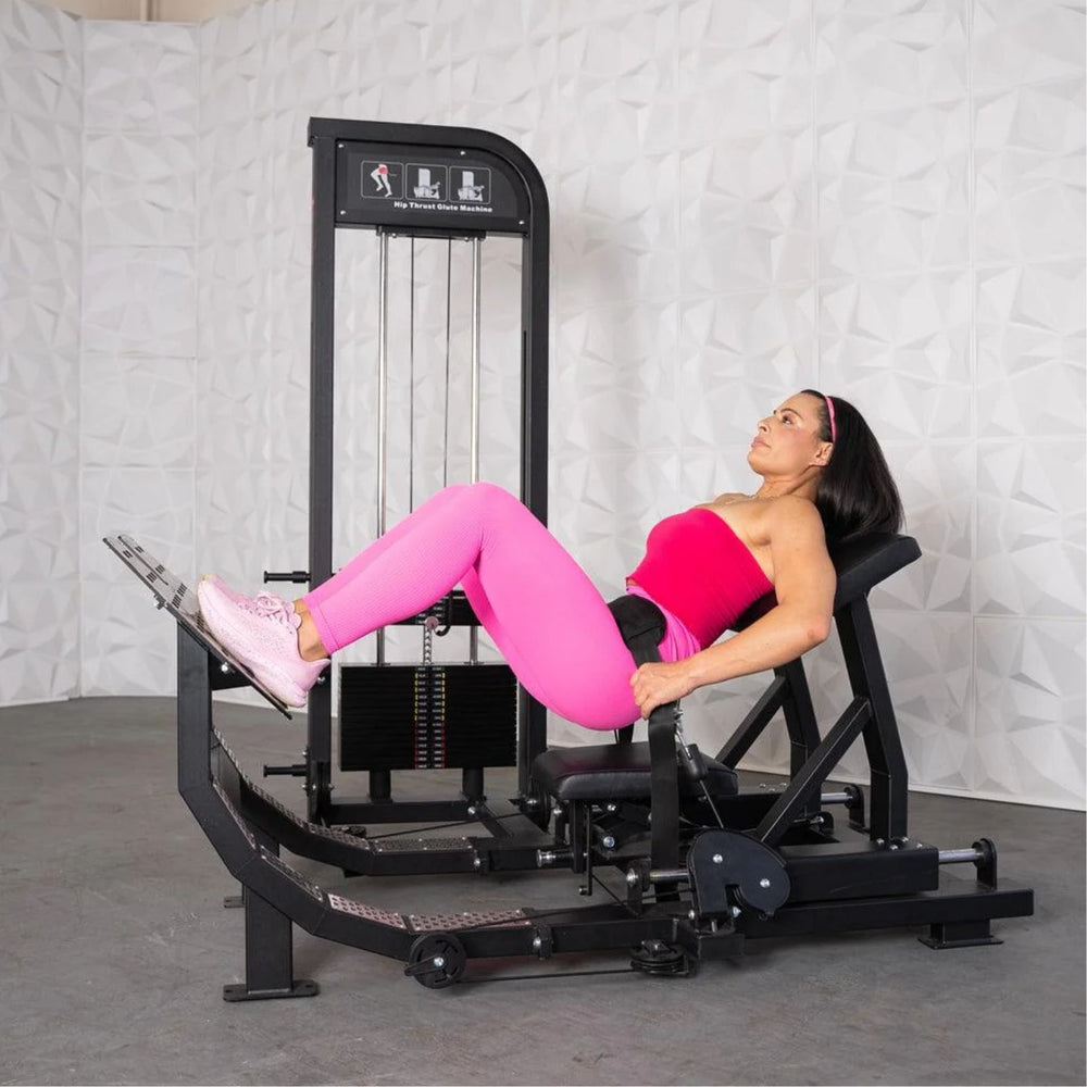 Woman exercising on a Excel Selectorized Hip Thrust Glute in a gym setting