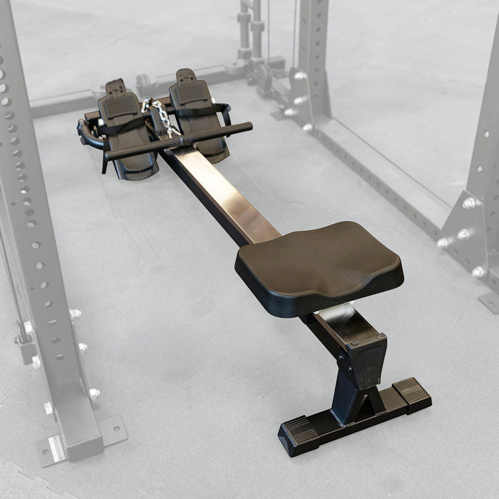 A rower installed in a body-solid power rack