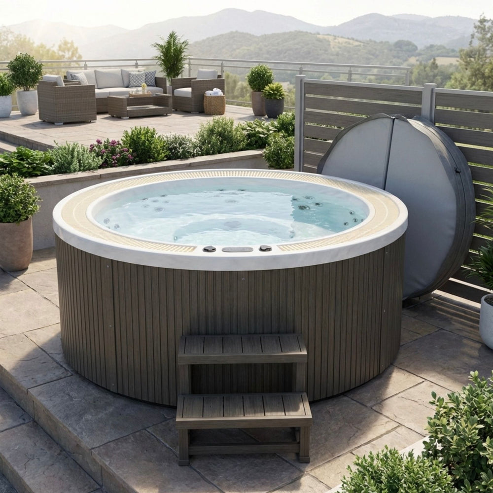 Round luxury spas oscar 6 person hot tub on a patio with outdoor furniture and plants