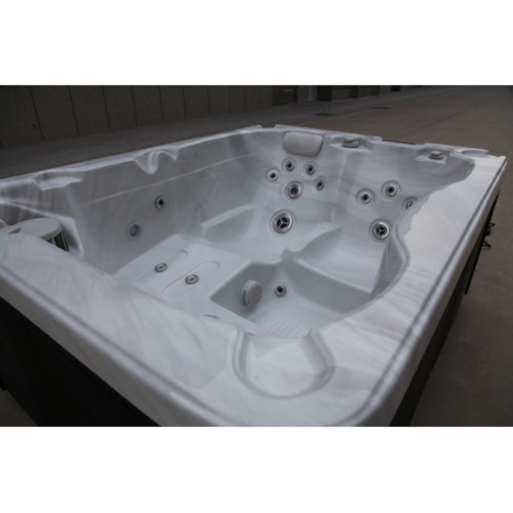 Luxury Spas Solice 3 - person hybrid hot tub with multiple jets on a white background