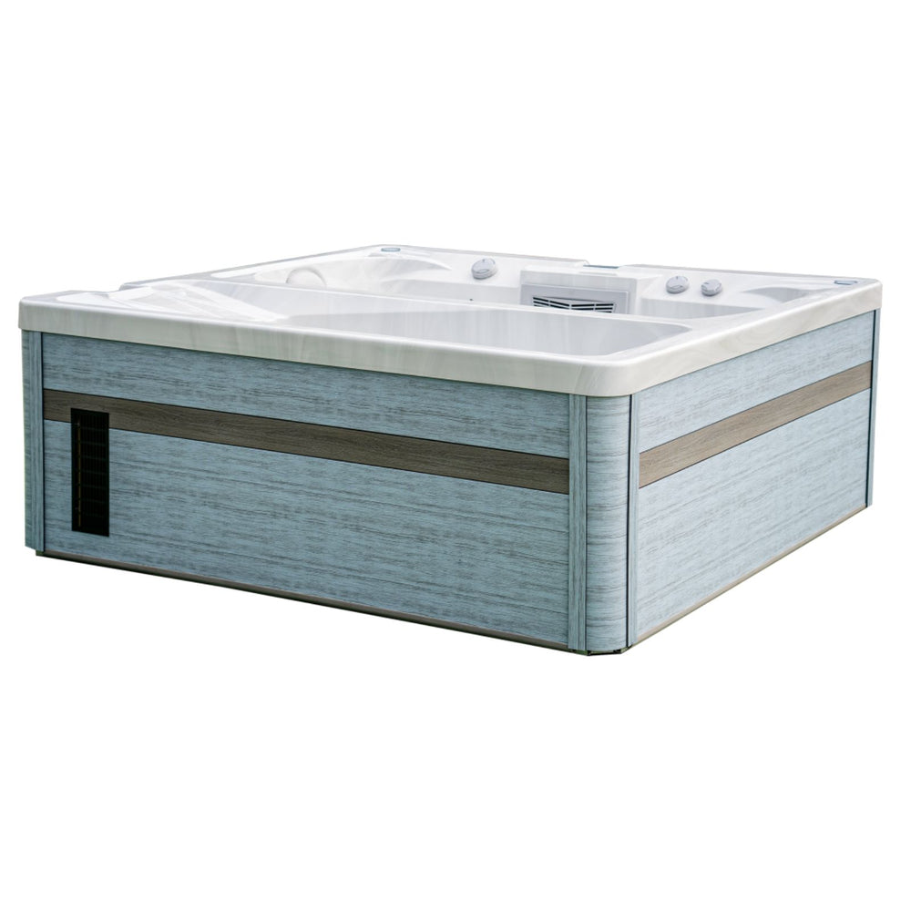 A rectangular Luxury Spas USA Marquis Hot & Cold Contrast Therapy Spa hot tub with a light blue wood-grain exterior, white interior, and integrated jets, shown on a plain white background.