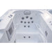 White outdoor Luxury Spas USA Marquis Hot & Cold Contrast Therapy Spa tub with multiple jet nozzles, side controls, and a vented panel, shown from a top-down angle on a white background.