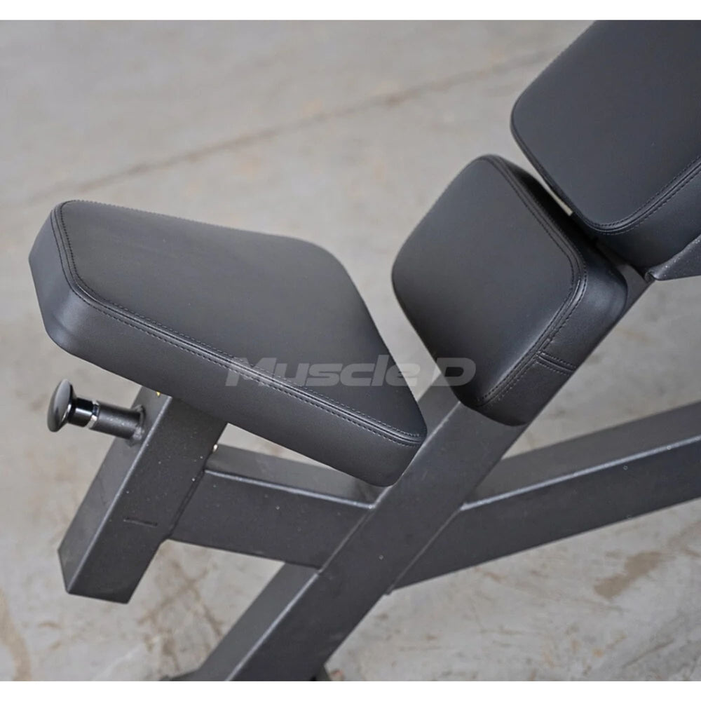 Muscle D weight leverage pec fly bench  adjustable seat with dark gray padded seat and backrest on a metal frame, photographed on a light concrete floor. A large 'MuscleD' watermark is visible across the center.