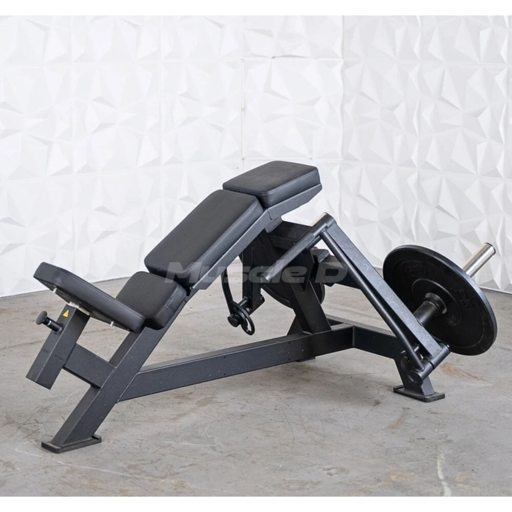 Muscle D weight leverage pec fly bench with padded black seat and backrest, mounted on a dark metal frame with a barbell and weight plate, photographed against a textured white wall and concrete floor.
