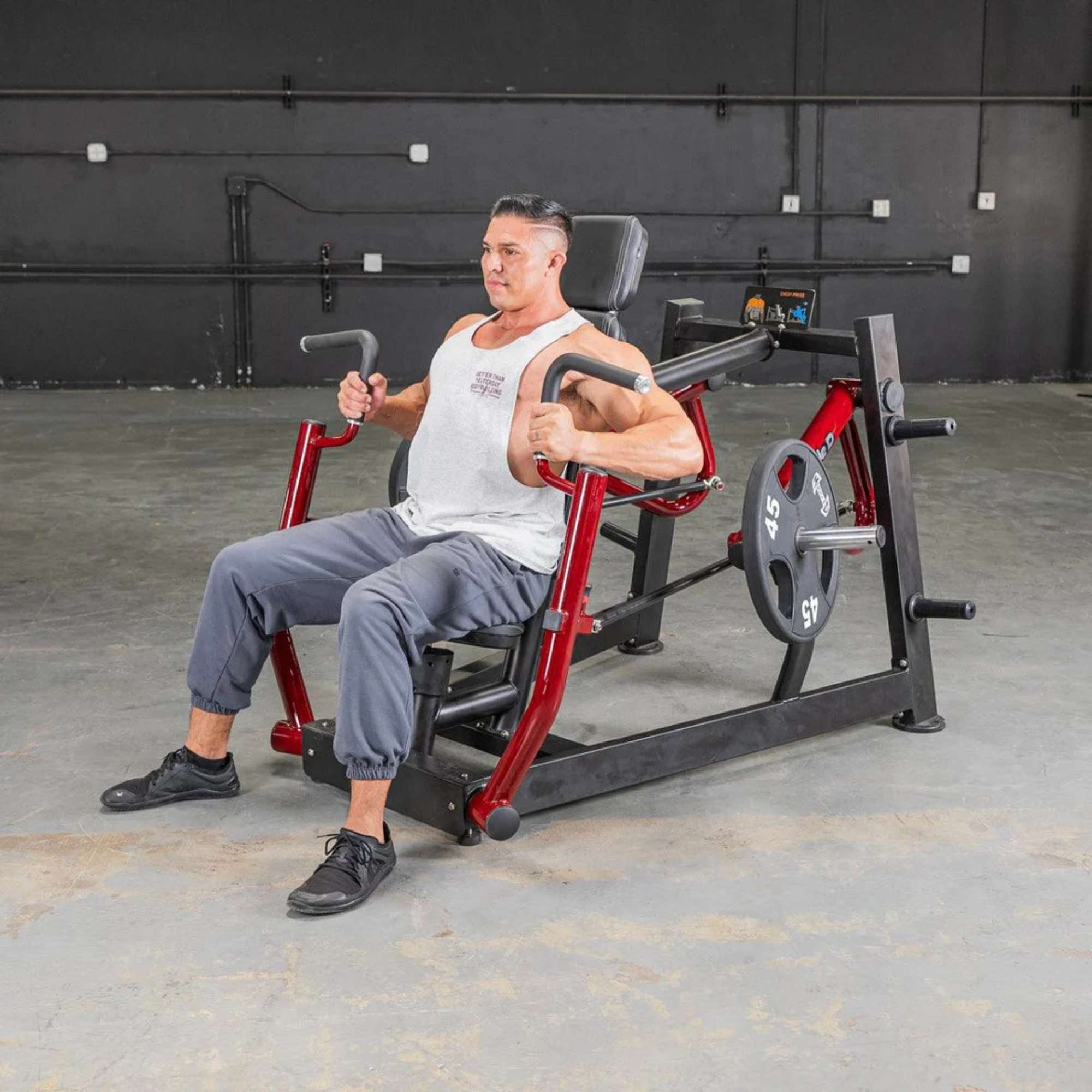 Muscle D Power Leverage V2 Chest Press PL-PV2-CP - Side view of male performing chest press for strength training.