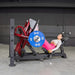 Athlete using the Muscle D Power Leverage V2 Leg Press in a neutral stance for a lower-body strength exercise.