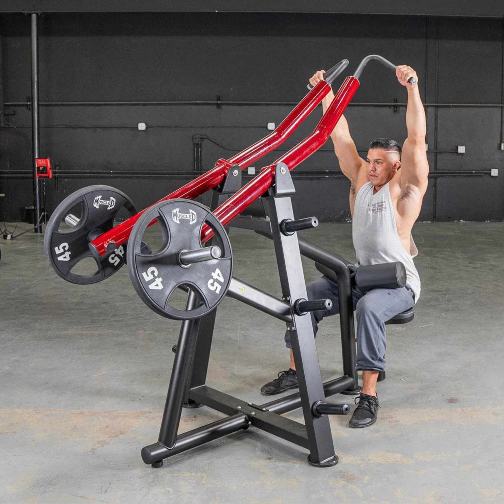 Muscle D Power Leverage V2 Iso-Lateral Lat Pulldown, highlighting independent arm movement with a male athlete using a neutral grip.