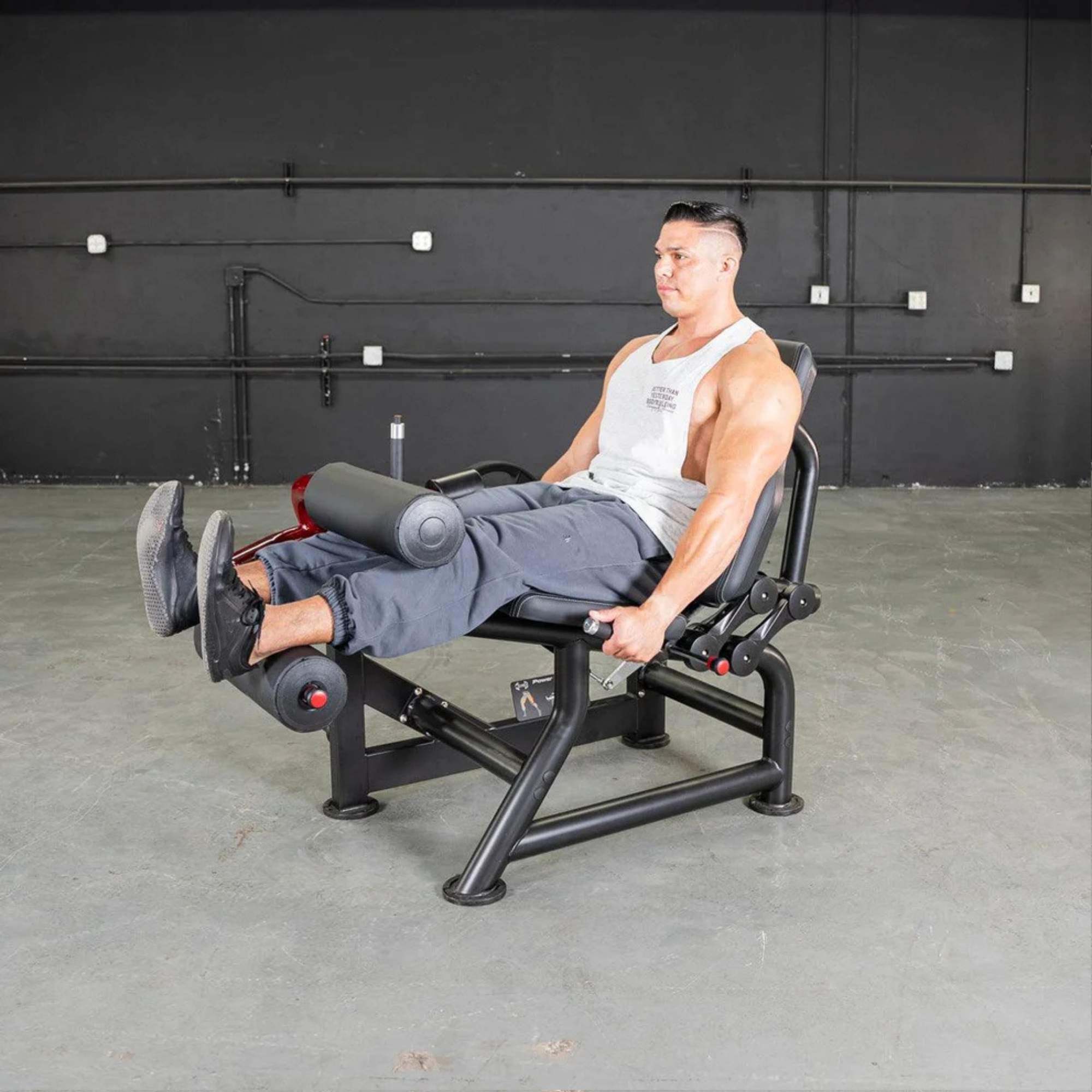 Muscle D Power Leverage V2 Seated Leg Curl in use, highlighting hamstring-focused workout for gym enthusiasts.