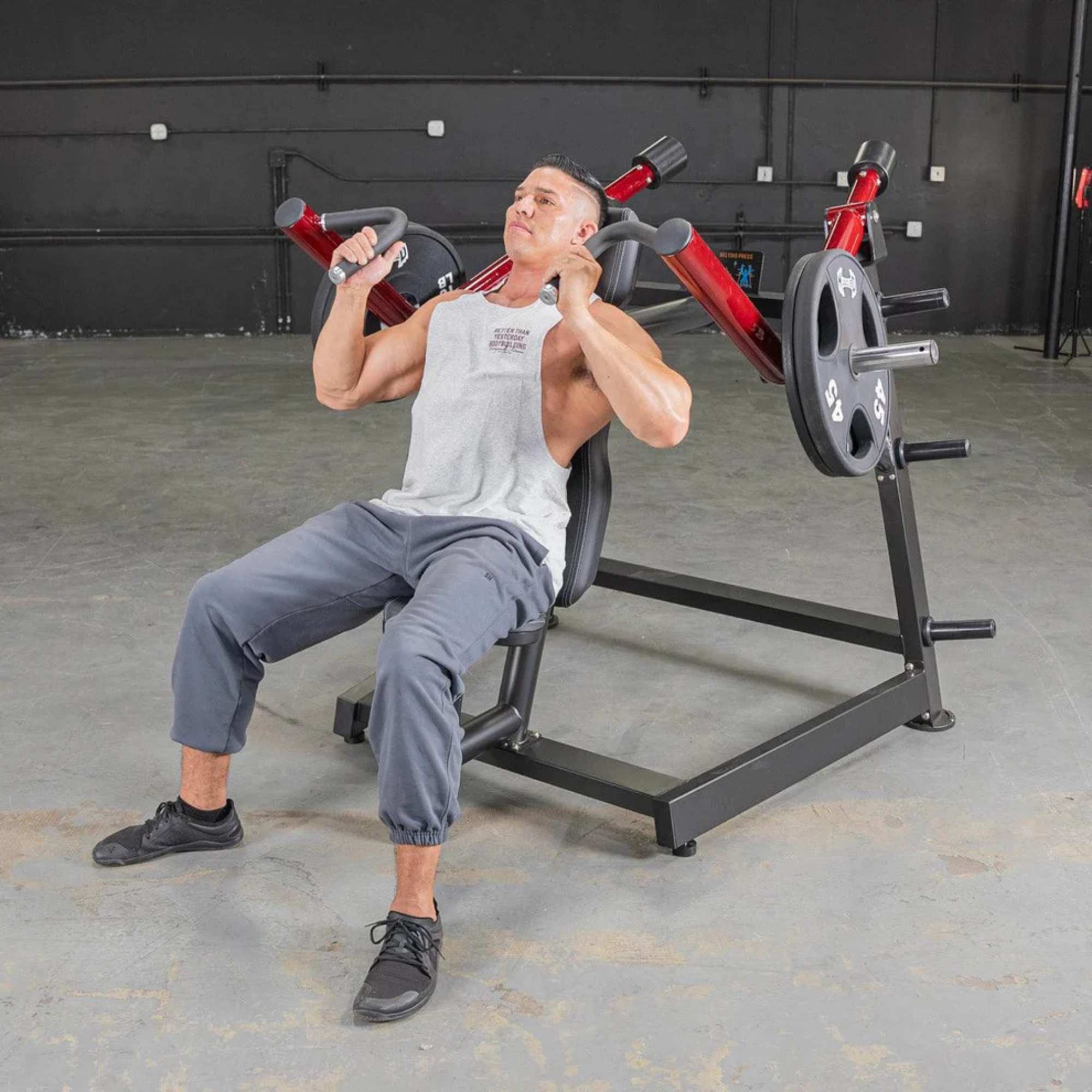 Man demonstrating Muscle D Power Leverage V2 Shoulder Press machine