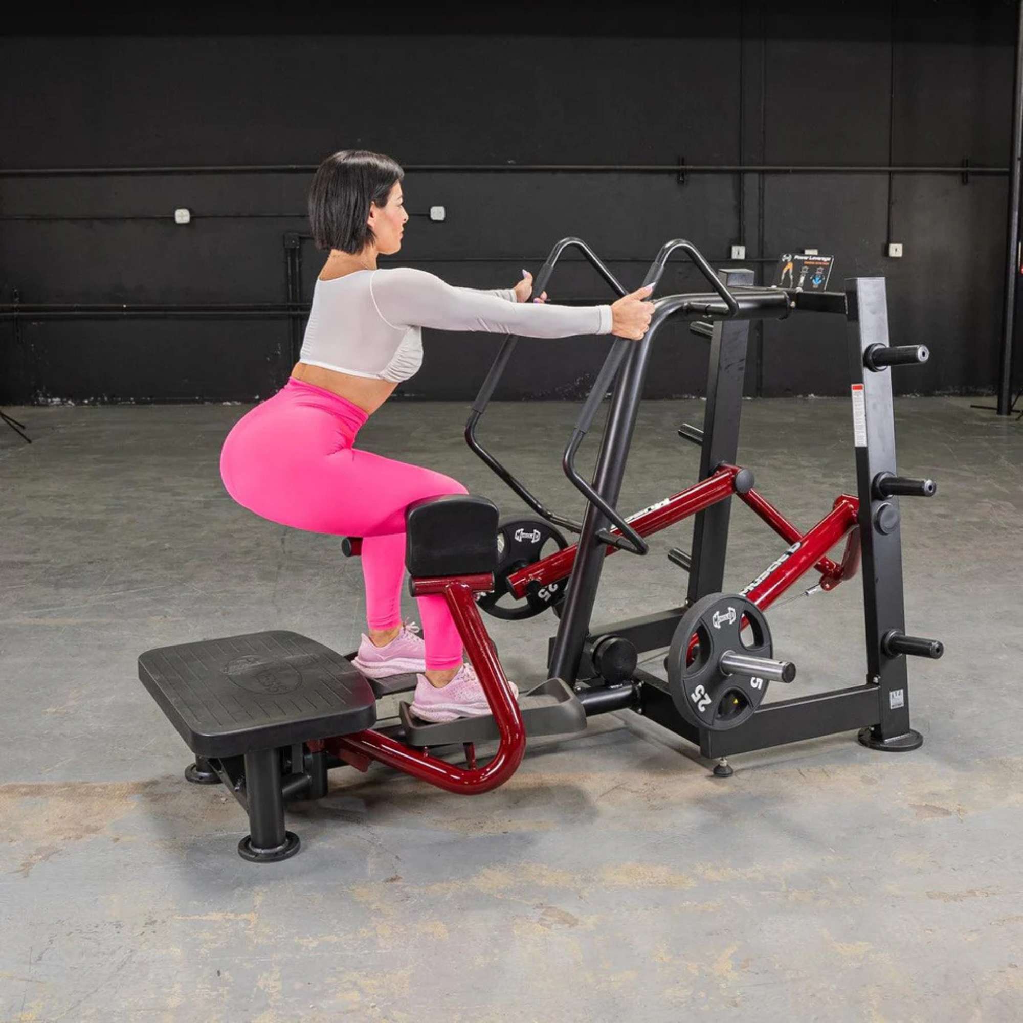 Muscle D Power Leverage V2 Standing Abductor PL-PV2-SA equipment demonstrated with woman engaging in a strength exercise.